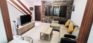 TV a/nebo společenská místnost v ubytování Arinaga Beach Gran Canaria