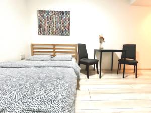 Postel nebo postele na pokoji v ubytování ティエラ北池袋