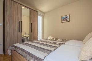 Voodi või voodid majutusasutuse AP 6+2 in one of the most luxury building in Omis toas