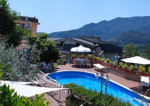 a resort with a swimming pool and a building at Villa Elvira in Pellezzano