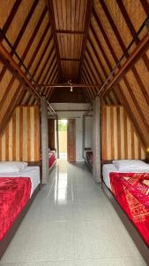 Ένα ή περισσότερα κρεβάτια σε δωμάτιο στο Puri Pilihani Hostel +27 φωτογραφίες