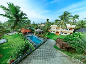 an aerial view of a resort with a swimming pool at Asokam Beach Resort in Kannur +74 photos