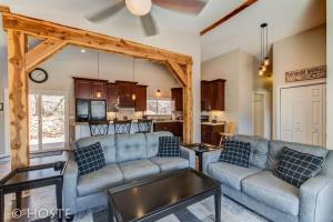 a living room with two couches and a kitchen at *H* NEW! 4BR Garden of the Gods Retreat in Colorado Springs
