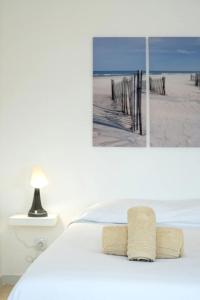 a bedroom with a bed and a view of a beach at BLife Benya private apartment in Faro