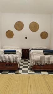 Llit o llits en una habitació de Dar Gara