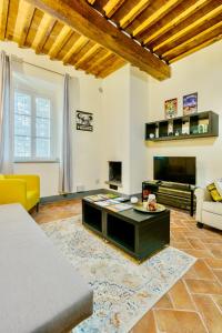 a living room with a couch and a coffee table at Borgo di Libbiano - for exploring all of Tuscany in Libbiano