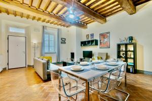 a living room with a large table and chairs at Borgo di Libbiano in Libbiano