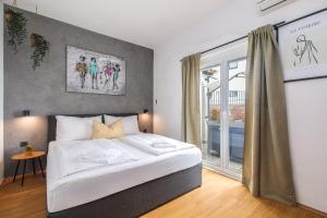 Ένα ή περισσότερα κρεβάτια σε δωμάτιο στο Apartment house LiJan +39 φωτογραφίες