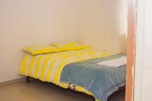 A bed or beds in a room at Itawa Apartments