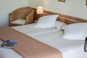 Postel nebo postele na pokoji v ubytování Hotel Ancora