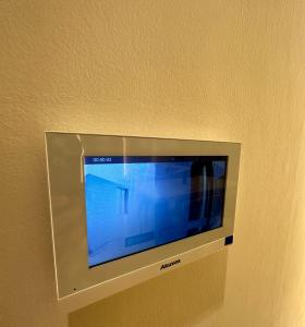 a flat screen tv on a wall in a room at fin apartment C6 in Riyadh