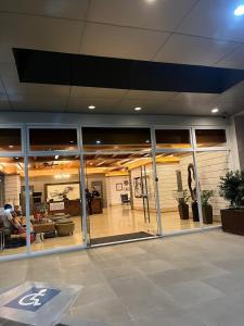 a lobby of a building with large glass windows at 2P Cool Home Tagaytay at SMDC Cool Suite Residences in Tagaytay