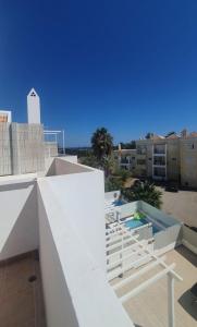 a view from the balcony of a building at Sand, Water & Sun House in Vila Nova De Cacela
