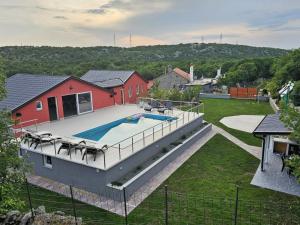 an aerial view of a house with a swimming pool at Holiday House Nirvana in Bakarac