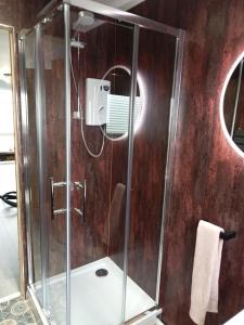 a shower with a glass enclosure in a bathroom at 11 Headwards Retreat in Great Yarmouth +17 photos