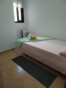 Postel nebo postele na pokoji v ubytování Habitación Ático Sol y Mar