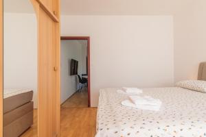 Postel nebo postele na pokoji v ubytování Apartman Sara