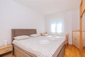 Postel nebo postele na pokoji v ubytování Apartman Sara