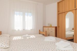 Postel nebo postele na pokoji v ubytování Apartman Sara