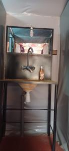 a bathroom sink with a faucet on a table at Mustapha Camp Merzouga in Merzouga