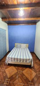 Ένα ή περισσότερα κρεβάτια σε δωμάτιο στο Hospedaje el Jaguar Pacífico