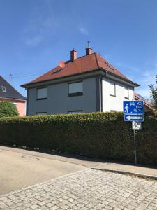 a street sign in front of a house at Gästehaus Nicole in Burgau