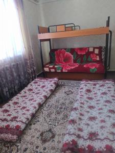 Un ou plusieurs lits dans un hébergement de l'établissement Hostel Jusup