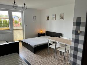 Postel nebo postele na pokoji v ubytování Willa Sarbinowo