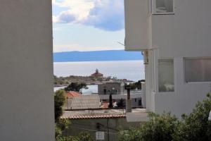 a view of the ocean from a building at Villa Melassy in Makarska