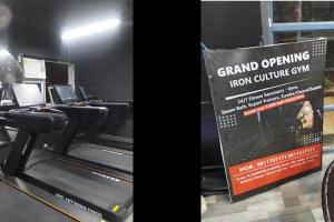 a sign that says grand opening iron culture gym at Sandal suite by Mulberry Homestays in Noida