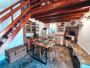a kitchen with a wooden table in a room at Castaway's View Villa in Avlákia