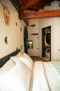 A bed or beds in a room at Areto Butik Otel