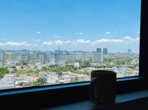 a view of a city from a window at Livahome - PDT Lux homestay Di An HCMC in Dĩ An
