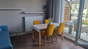 Posedenie v ubytovaní Apartament z HUŚTAWKĄ Bel Mare