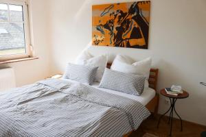 Postel nebo postele na pokoji v ubytování Ferienwohnung am Hauptplatz