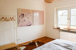 a white room with a bed and a window at Ferienwohnung am Hauptplatz in Sankt Stefan ob Stainz