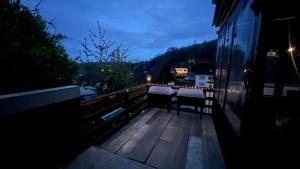 a balcony with a table and chairs on a building at Monteurzimmer/Ferienwohnung/Pension in Siegen
