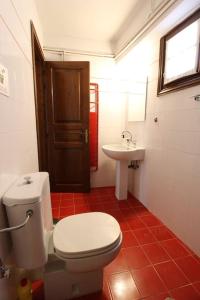 a bathroom with a toilet and a sink at Raise Polydrosos Traditional Getaway in Polydrossos +25 photos