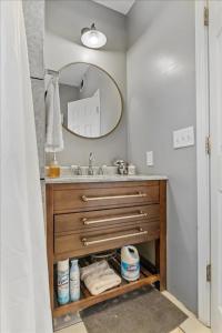 a bathroom with a sink and a mirror at PetFriendly 2BR Convenient to Stadium&Downtown - ctd in Indianapolis