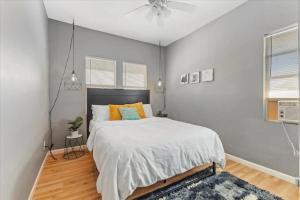 a bedroom with a bed and a ceiling fan at PetFriendly 2BR Convenient to Stadium&Downtown - ctd in Indianapolis