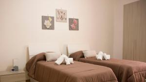Letto o letti in una camera di Guest House Nonna Angela