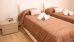 Letto o letti in una camera di Guest House Nonna Angela