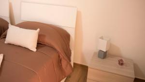Letto o letti in una camera di Guest House Nonna Angela