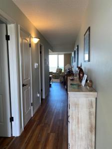 a hallway of a home with a kitchen and a living room at Pelican Condominium in New Smyrna Beach