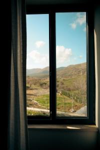 a window in a room with a view of a field at Areto Konak Otel in Dereköy