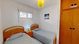 Postel nebo postele na pokoji v ubytování Palatino Albir