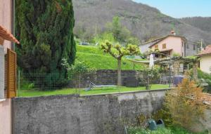 a view of a garden with a bench in a yard at Nice Home In Azzano With Wifi in Azzano