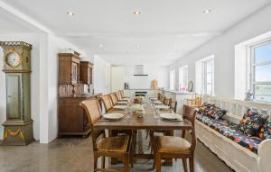 a dining room with a long table and a couch at Beautiful Home In Humble With Wifi in Humble
