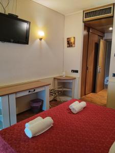 Postel nebo postele na pokoji v ubytování Hotel Xibana