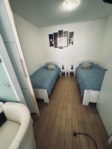 Ένα ή περισσότερα κρεβάτια σε δωμάτιο στο Appartement NITI